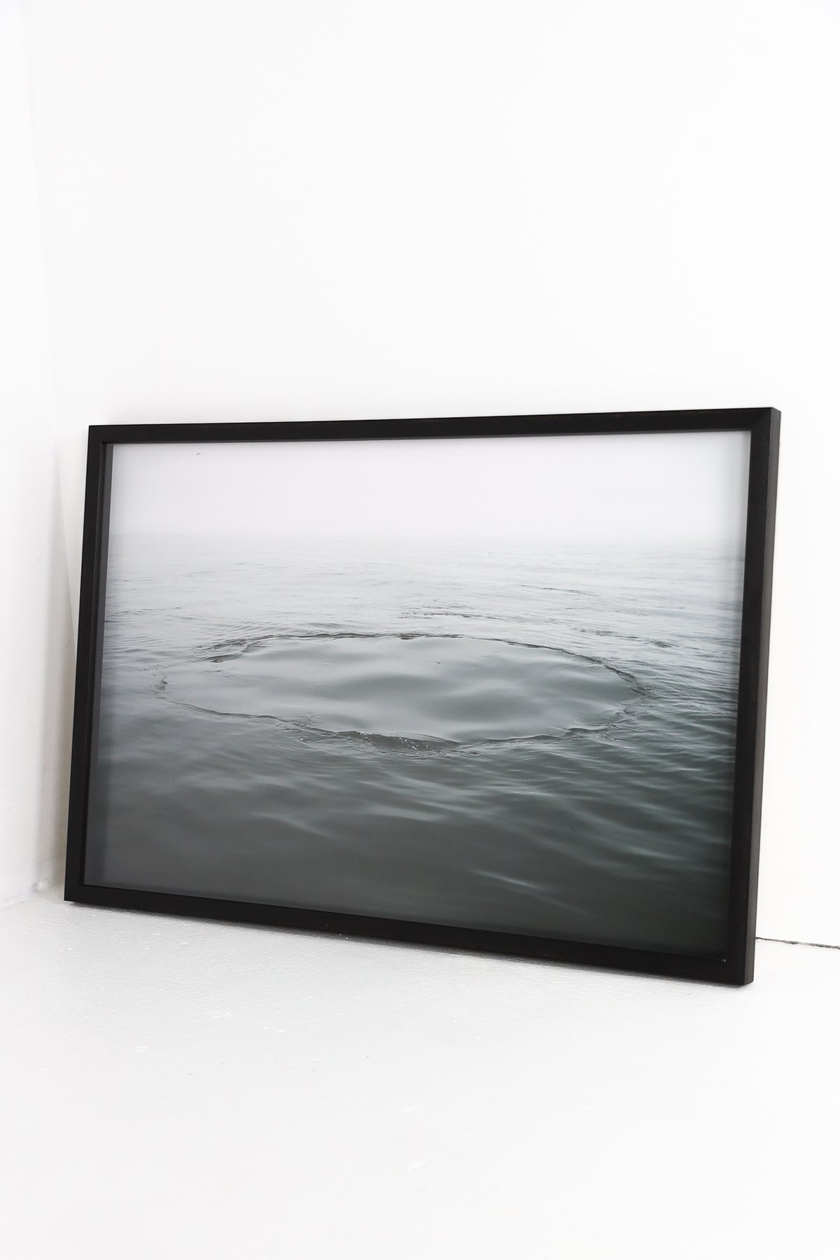 Water ripples framed in black frame