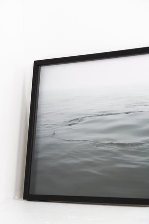 Water ripples framed in black frame