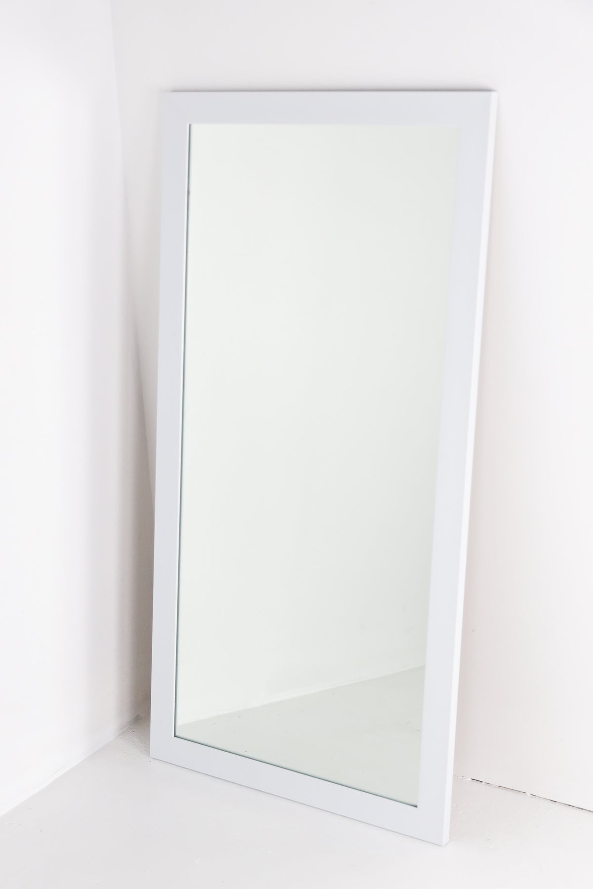 Mirror in white frame